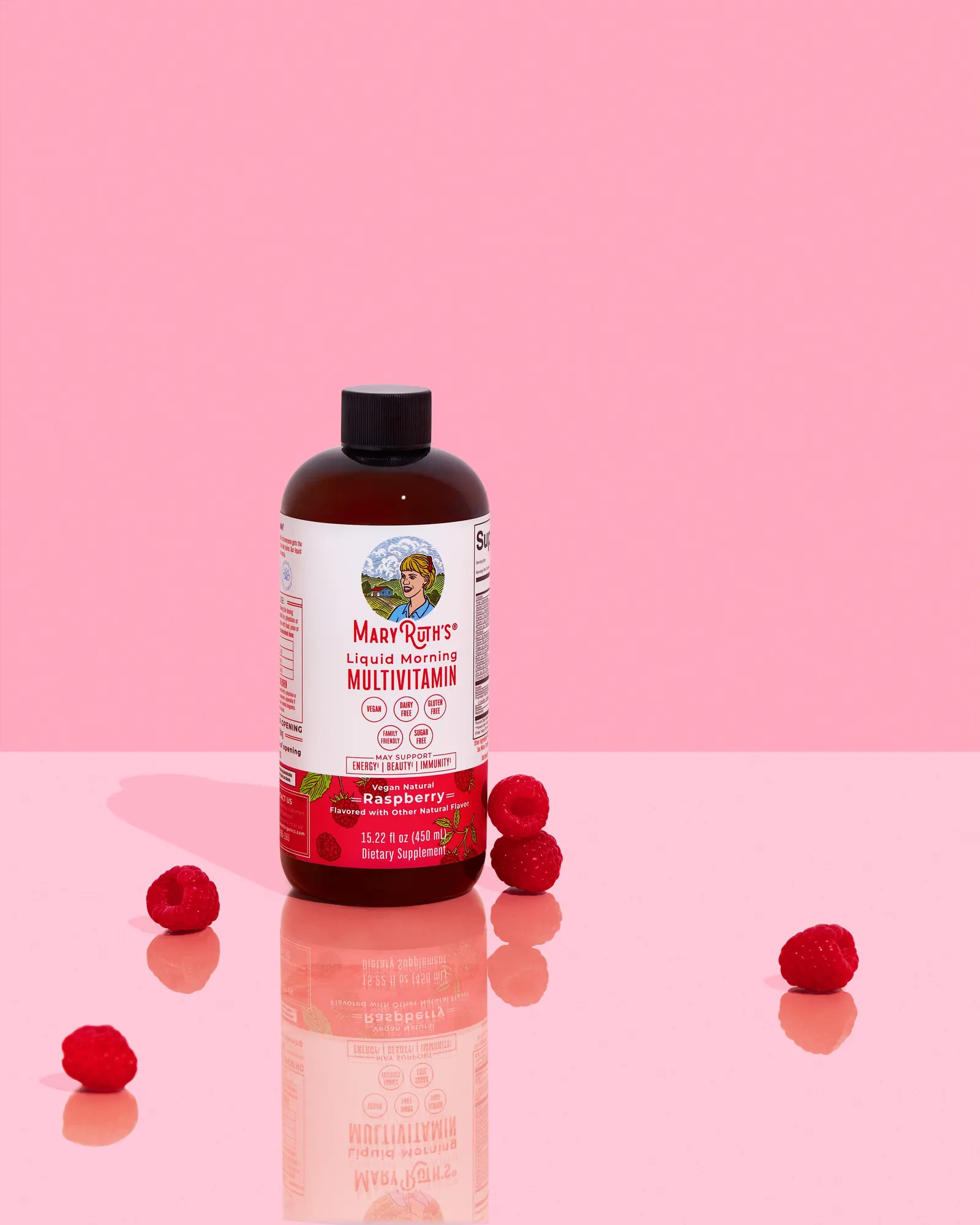 MaryRuth Liquid Morning Multivitamin raspberry bottle styled on a soft pink set
