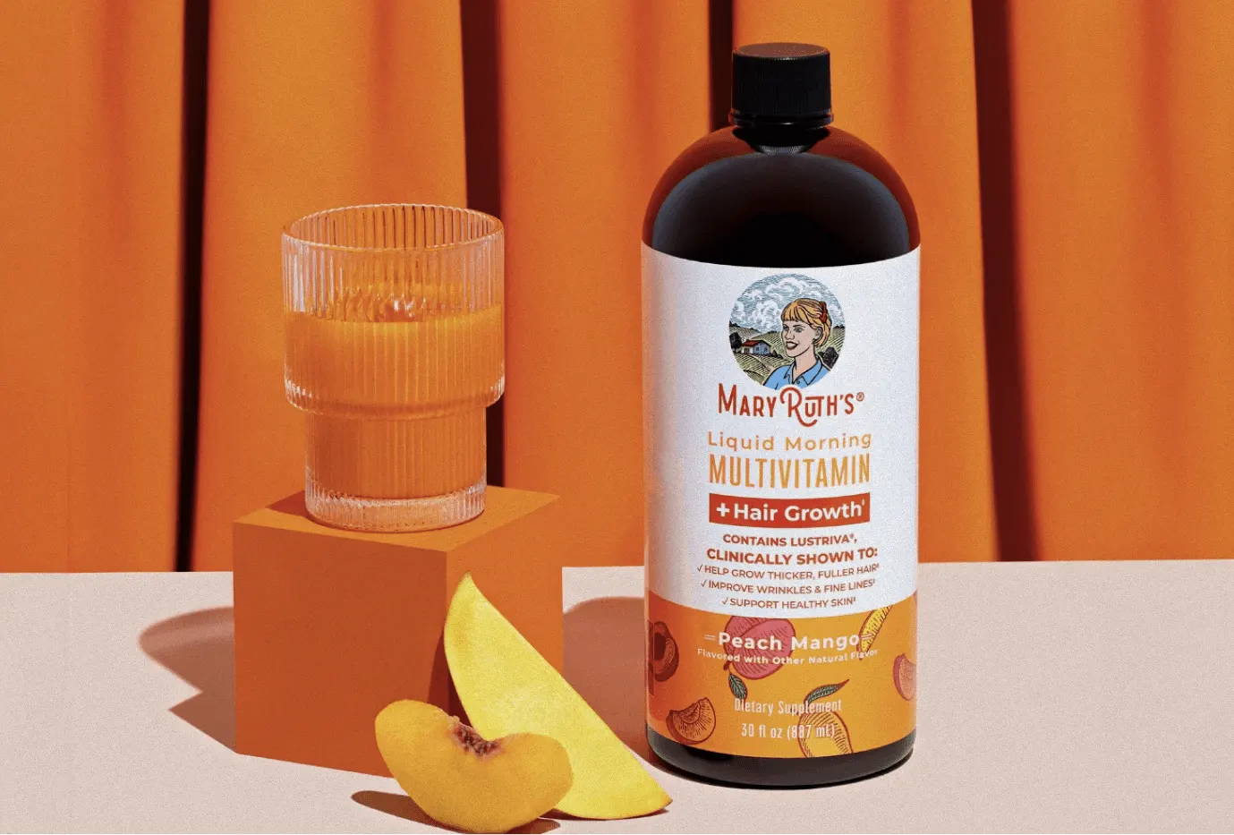 MaryRuth’s peach mango multivitamin on orange