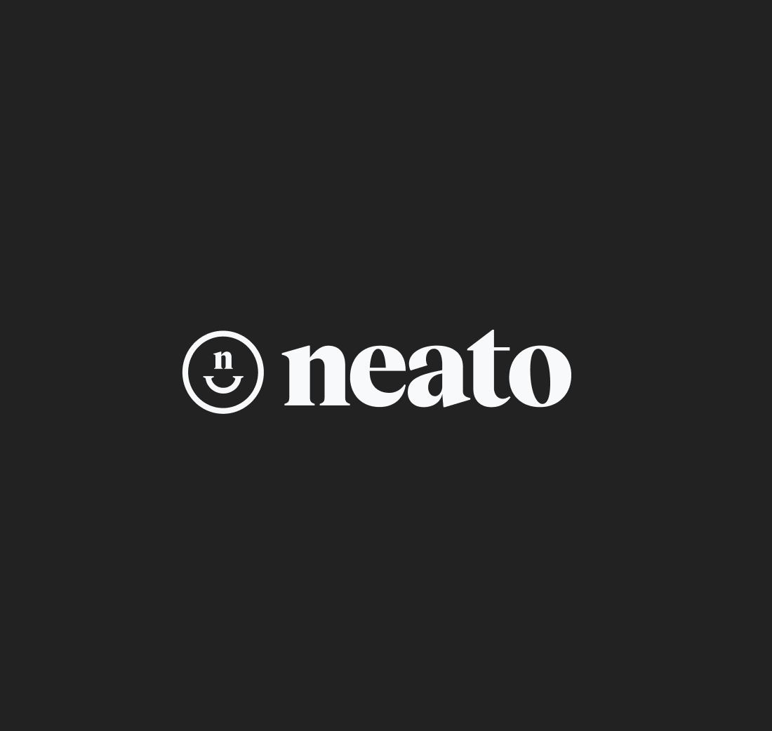Neato smiley 'n' wordmark in white on a dark charcoal background